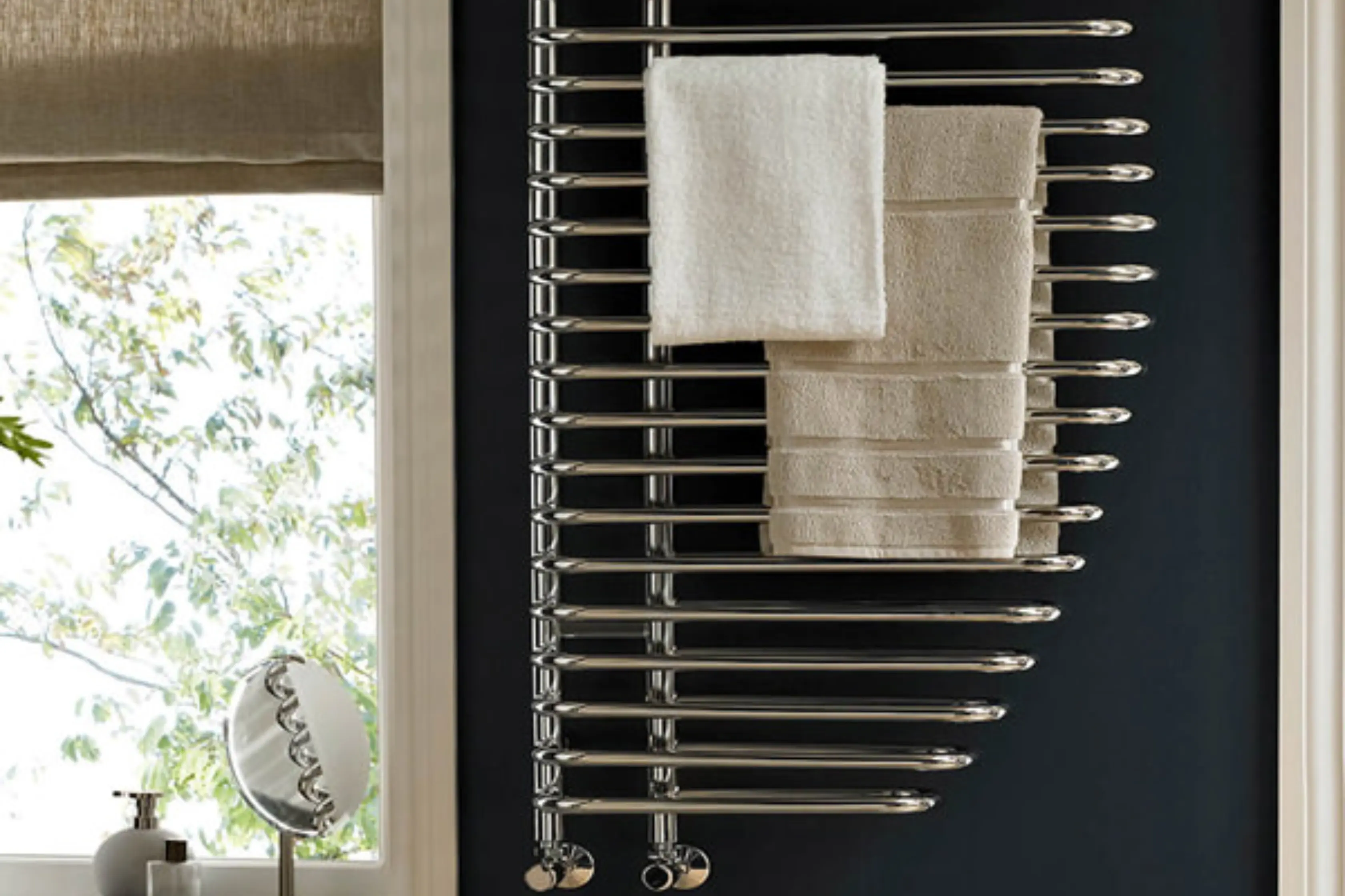 Designer Towel Rail In Modern Bathroom